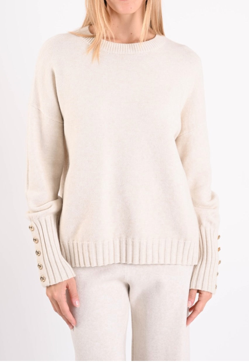 Maglione panna con bottoni ai polsini