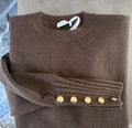 Maglione panna con bottoni ai polsini