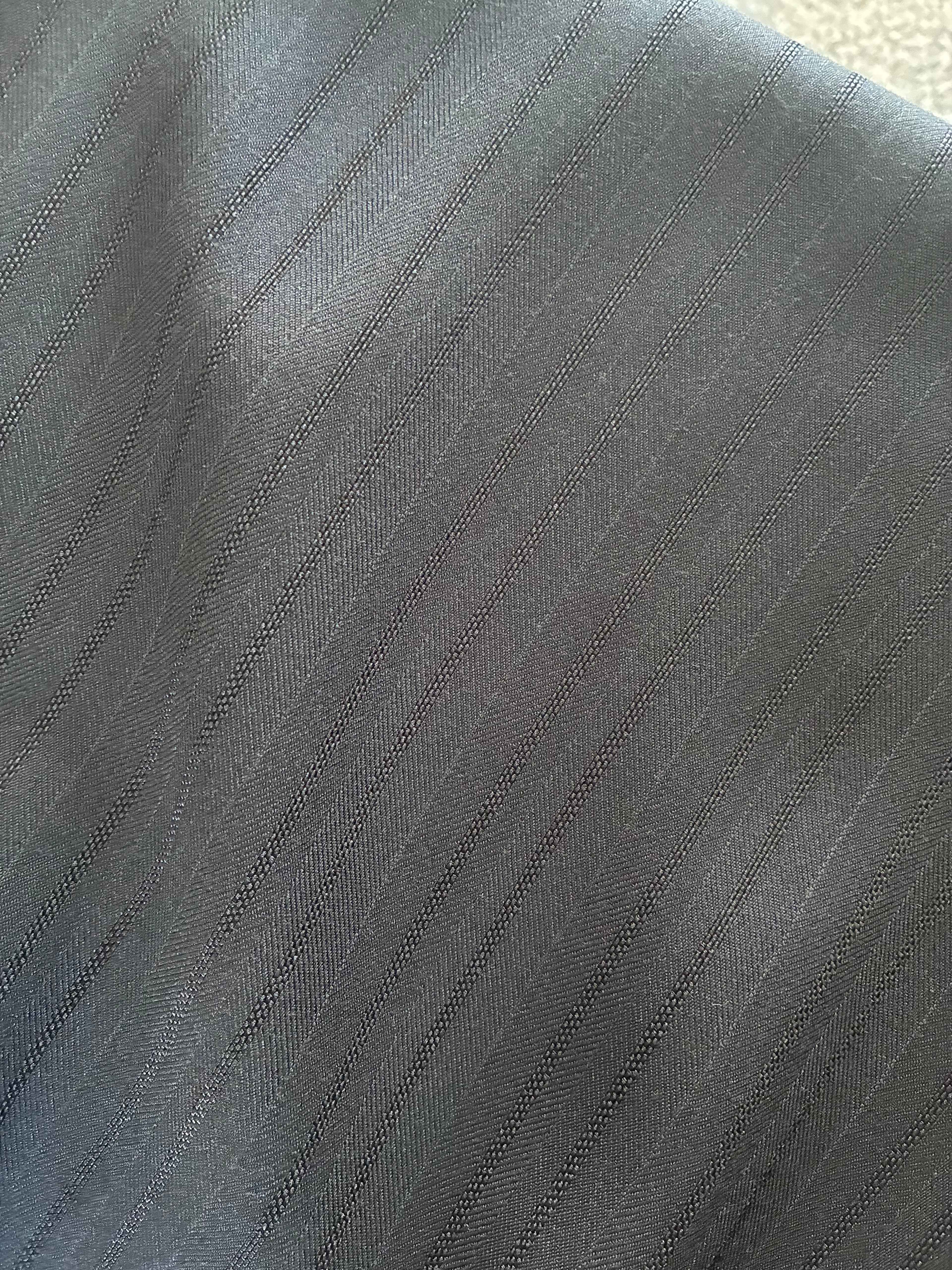 Pantalone palazzo gessato a vita alta