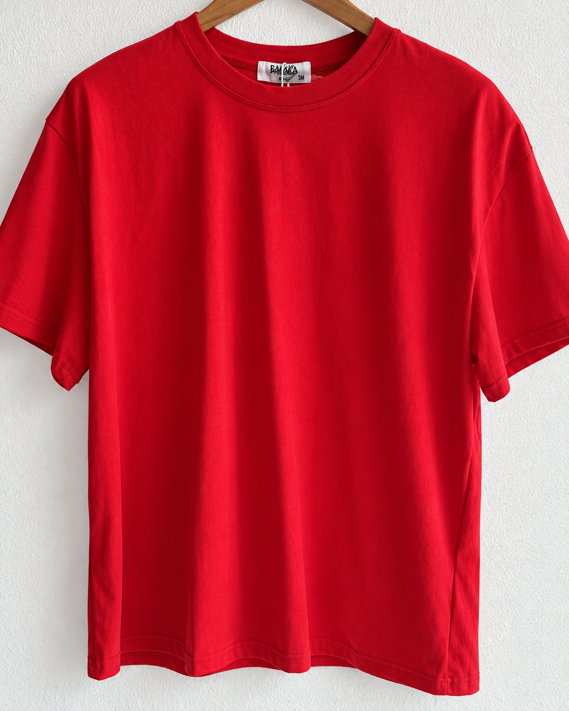 T-shirt oversize con spalline